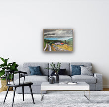 Load image into Gallery viewer, Wooden frame styled painting in same sitting room above grey sofa. 