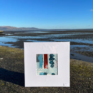 Mini abstract painting sitting on sea wall in Blackrock 