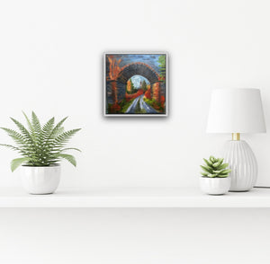 Image of white framed painting on a white wall above a shelf with potted plants 