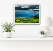 Load image into Gallery viewer, Room setting of painting in a white box frame on a white wall over shelf with potted plants. 