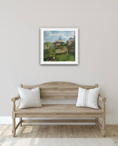 Hallway setting.  White frame painting image shown on wall above a wooden bench seat. 