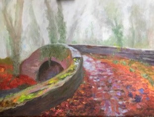 Moody Autumnal woods with bare trees covered in dark green ivy in background.  Oldbridge canal bridge from side view with red orange fallen leaves on the ground.  mossy bridge in foreground.  art for sale,  Oldbridge,  Co Meath. Ireland.  Autumn  art for sale.  gift ideas  