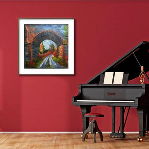 room setting on  a dramatic red wall  with a black piano   painting is framed in the image 